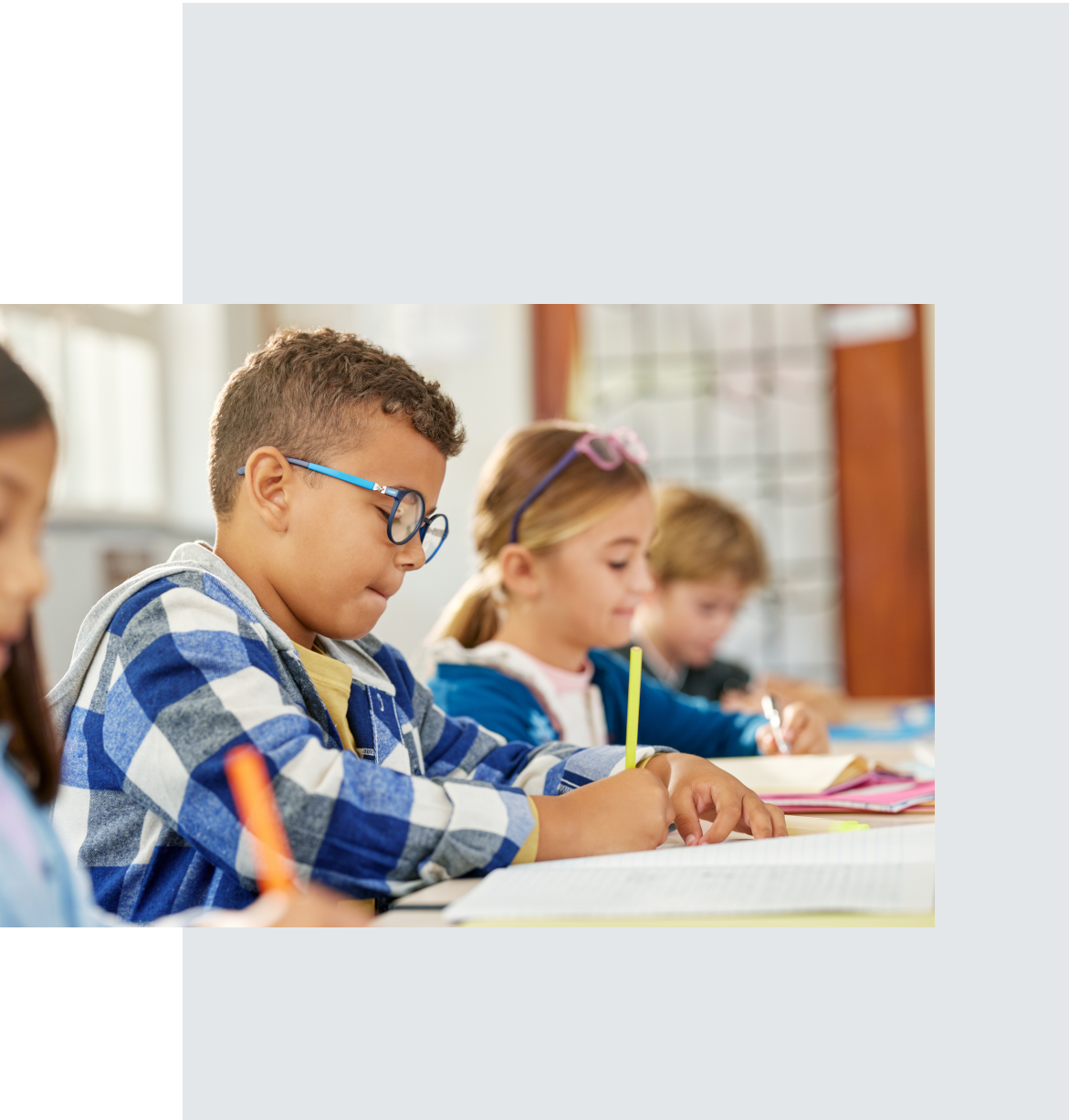 student writing in classroom